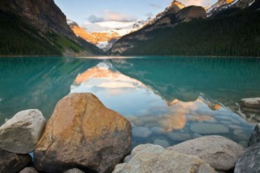 Rocky Mountains and boulders reflected in Lake Louise Banff National Park Alberta Canada Canvas Art - Larry Ditto DanitaDelimont (26 x 18)