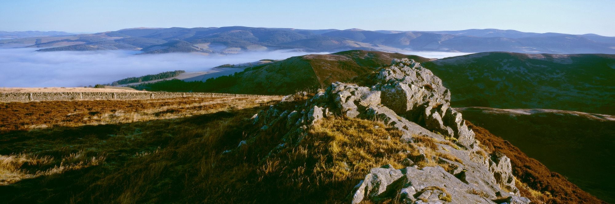 Rocky outcrop atop hills at misty morning Newby Kipps Glensax Scottish Borders Scotland Canvas Art - Panoramic Images (27 x 9)