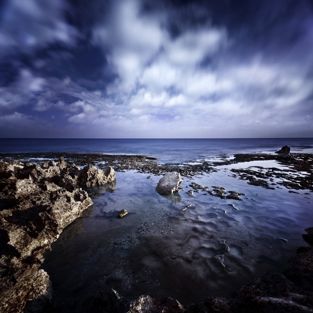 Rocky shore and tranquil sea against cloudy sky Sardinia Italy Canvas Art - Evgeny KuklevStocktrek Images (29 x 29)