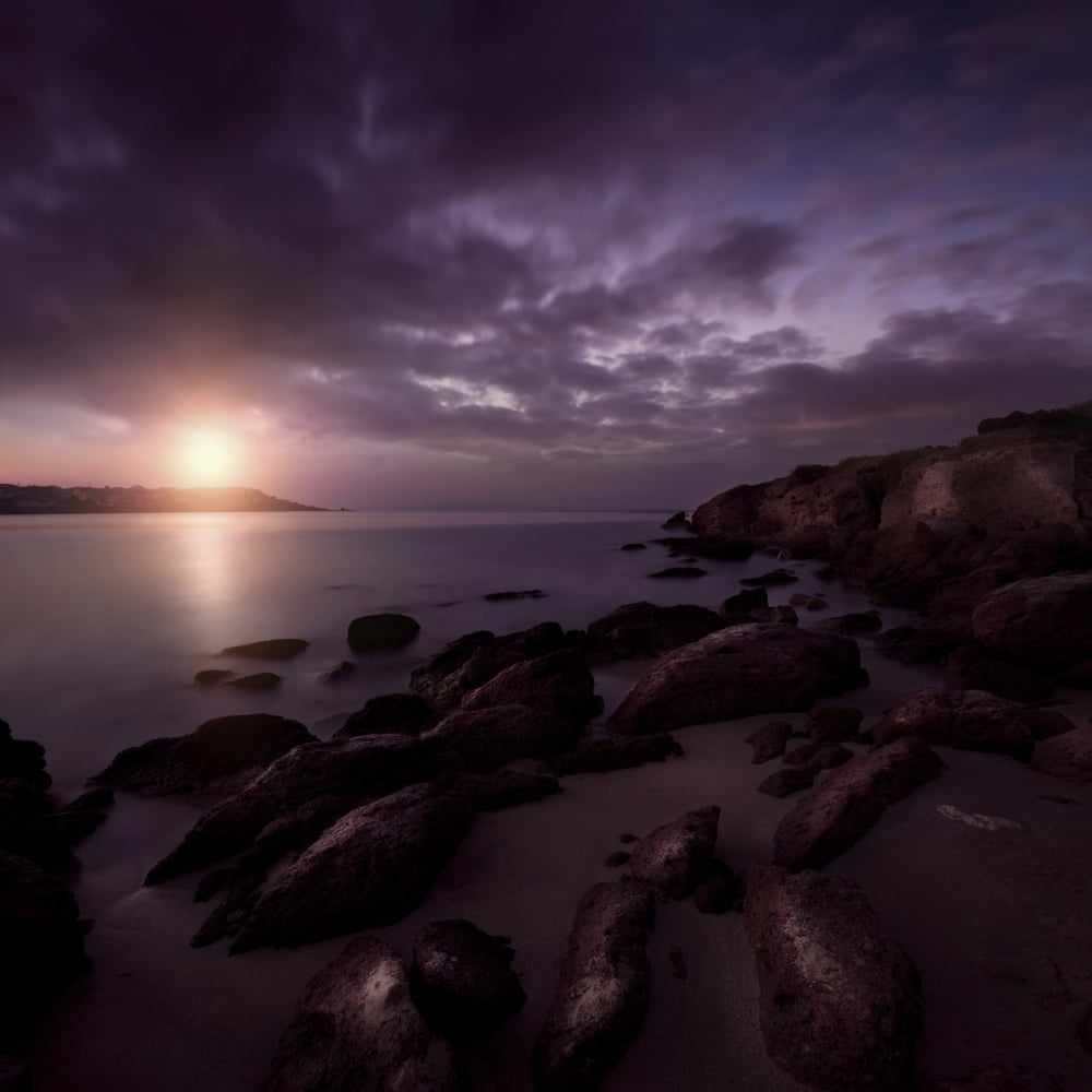 Rocky shore and tranquil sea against cloudy sky at sunset Sardinia Italy Canvas Art - Evgeny KuklevStocktrek Images (29 x 29)