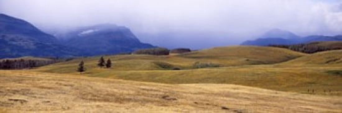 Rolling landscape with mountains in the background East Glacier Park Glacier County Montana USA Canvas Art - Panoramic Images (18 x 6)