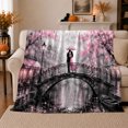 thumbnail image 1 of Romantic Couple On A Pink Blossom Bridge, Cozy Flannel Blanket with Romantic Painterly Cityscape Print, Housewarming Gift for Romantic Cityscape Admirers, Home Decor for Bedroom and Living Room, 1 of 7