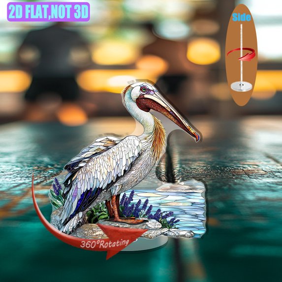 Rotating acrylic display showcasing a pelican skimming water with sandy shores and blue sea lavender in vibrant, detailed colors against a pure white background
