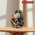 thumbnail image 1 of Rotating acrylic figurine featuring a radiant stained-glass dragon with swirling flames, phoenix feathers, and glowing crystals against a pristine white backdrop, 1 of 8
