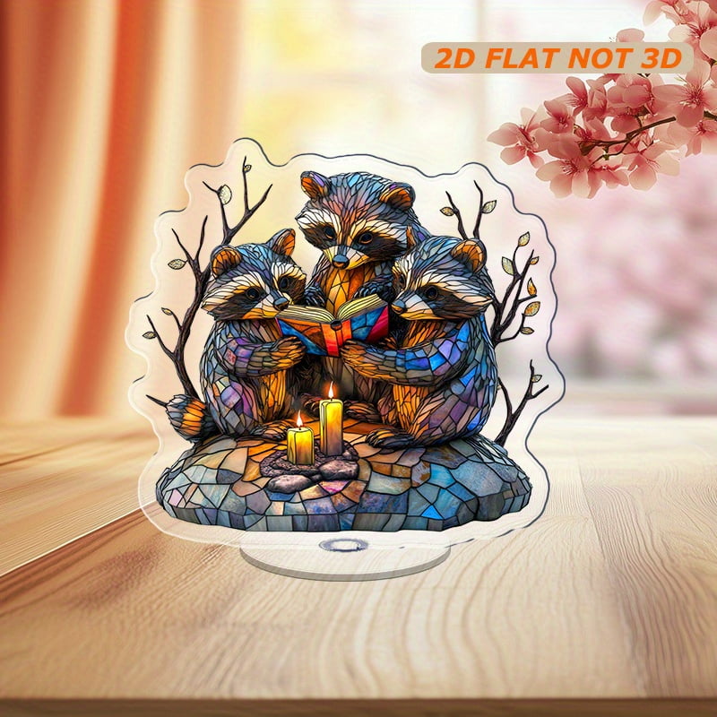 Rotating acrylic ornament featuring three intricately detailed raccoons ...