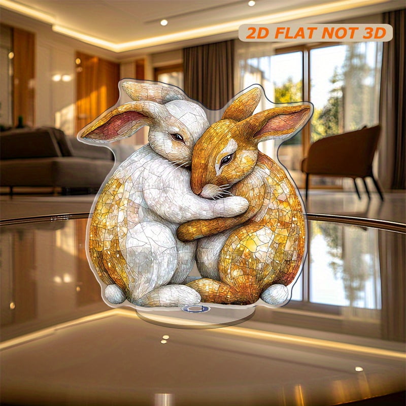 Rotating acrylic ornament featuring two yellow, brown and white rabbits ...