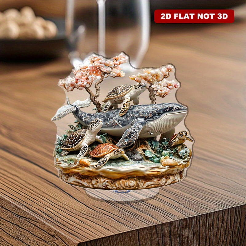 Rotating acrylic sculpture featuring intricately carved whales and ...