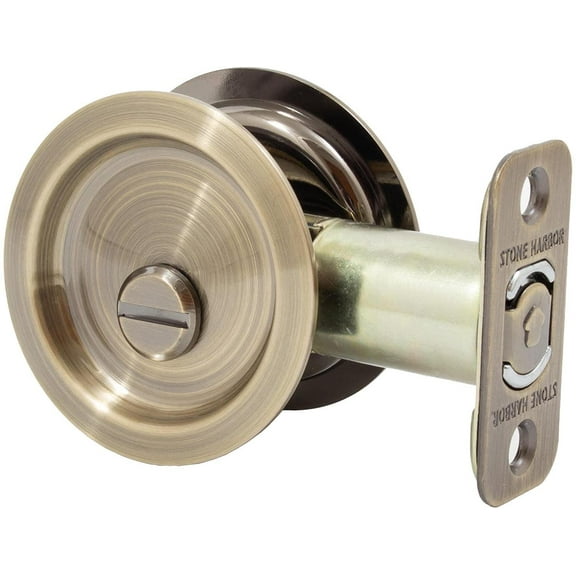 Round Pocket Door Lock, Privacy (Bed/Bath) Latch, 2-3/8" Backset, RCL, Antique Brass by Stone Harbor Hardware