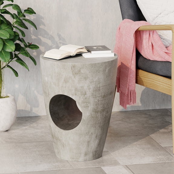Round drum - shaped outdoor side table | Placed next to sectional sofas outside | Beautifies outdoor environment