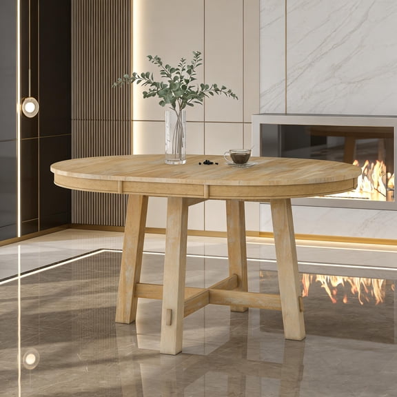 Round extendable farmhouse-style dining table with an antique white base, includes a 16-inch extension leaf to increase seating, wooden kitchen dining table