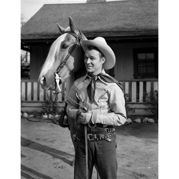 Roy Rogers standing and Holding the Horse's Reins Photo Print (24 x 30)