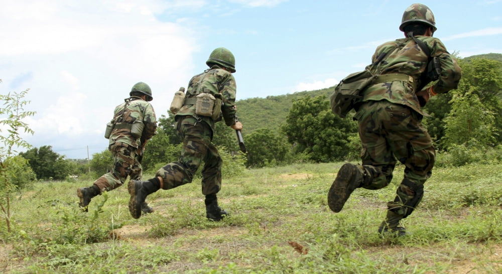 Royal Thai Marines rush forward to secure the site during an amphibious raid exercise Canvas Art - Stocktrek Images (37 x 21)