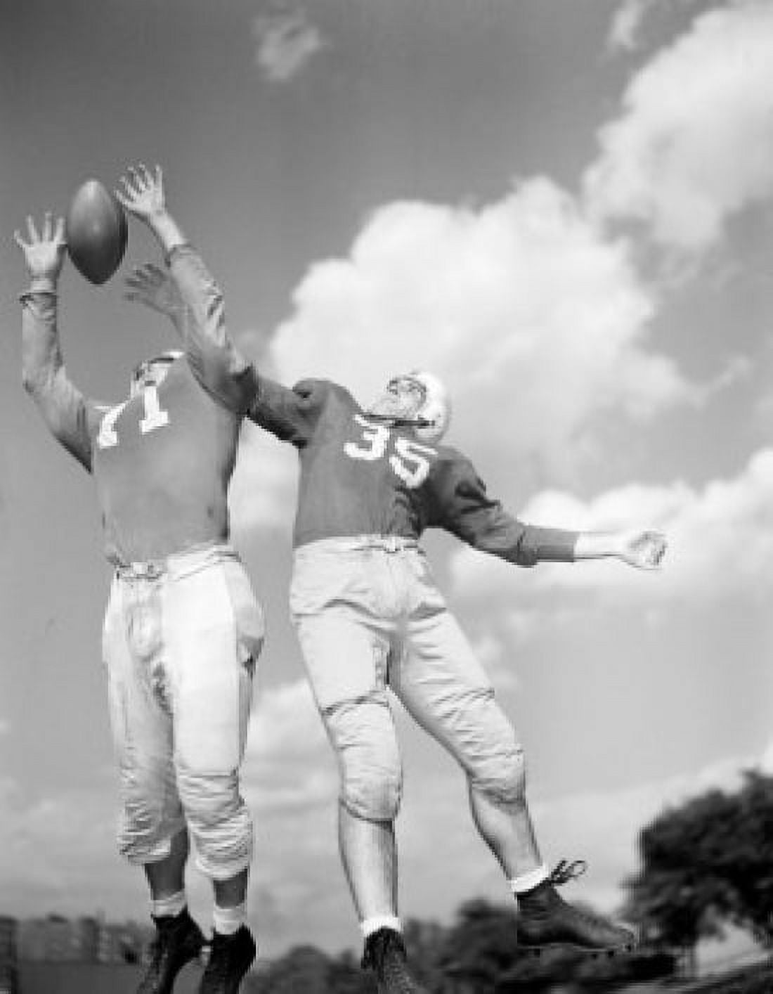 Rugby players trying to catch ball low angle view Canvas Art - (18 x 24)