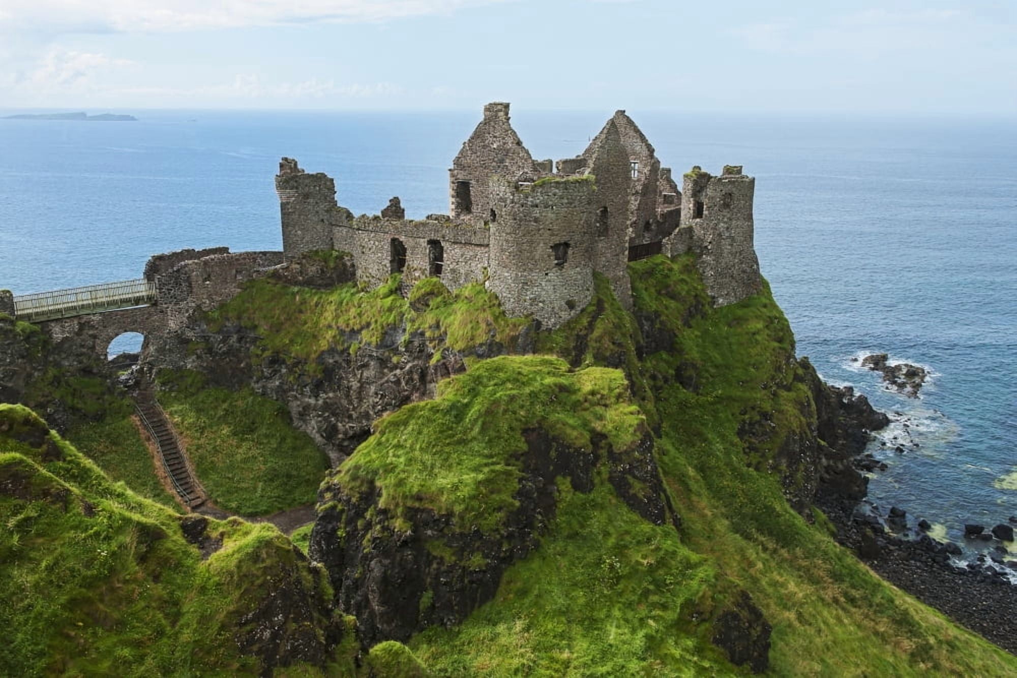 Ruin of Dunluce Castle on a hilltop at the waters edge County Antrim Ireland Canvas Art - Carl Bruemmer  Design Pics (38 x 24)