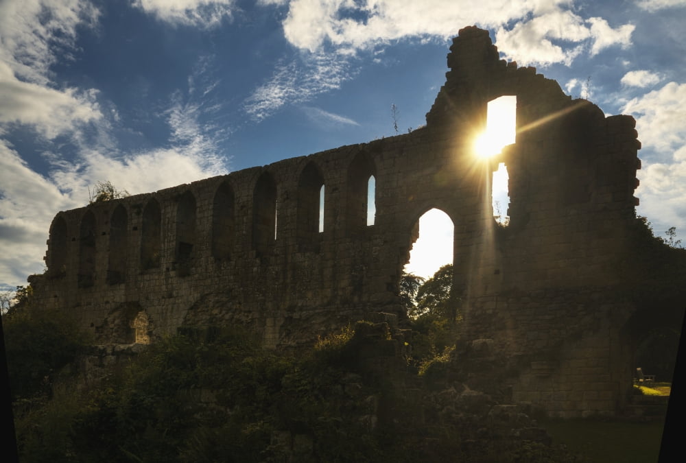 Ruins of Jeraulx Abbey with sunlight shining through a window Yorkshire Dales England Canvas Art - John Short Design Pics (19 x 13)
