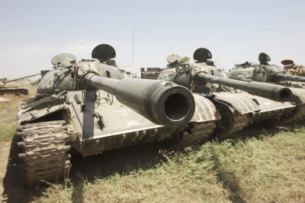 Russian T-54 and T-55 main battle tanks rest in an armor junkyard Canvas Art - Terry MooreStocktrek Images (18 x 12)