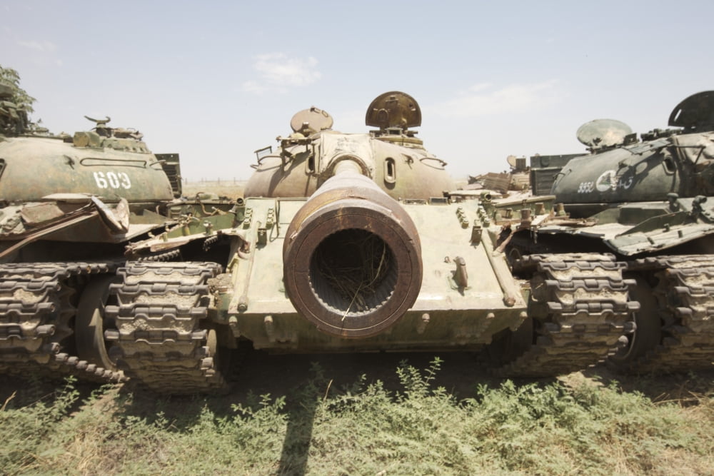 Russian T-54 and T-55 main battle tanks rest in an armor junkyard Canvas Art - Terry MooreStocktrek Images (18 x 12)