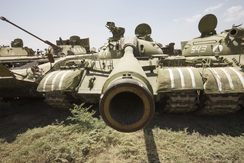 Russian T-54 and T-55 main battle tanks rest in an armor junkyard Canvas Art - Terry MooreStocktrek Images (18 x 12)