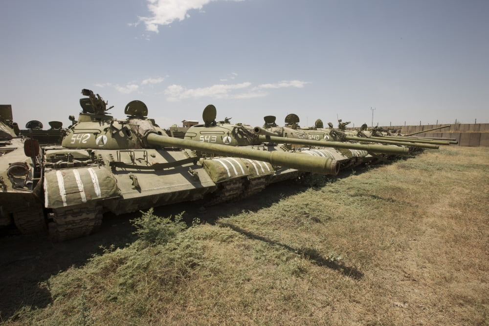 Russian T-54 and T-55 main battle tanks rest in an armor junkyard Canvas Art - Terry MooreStocktrek Images (18 x 12)