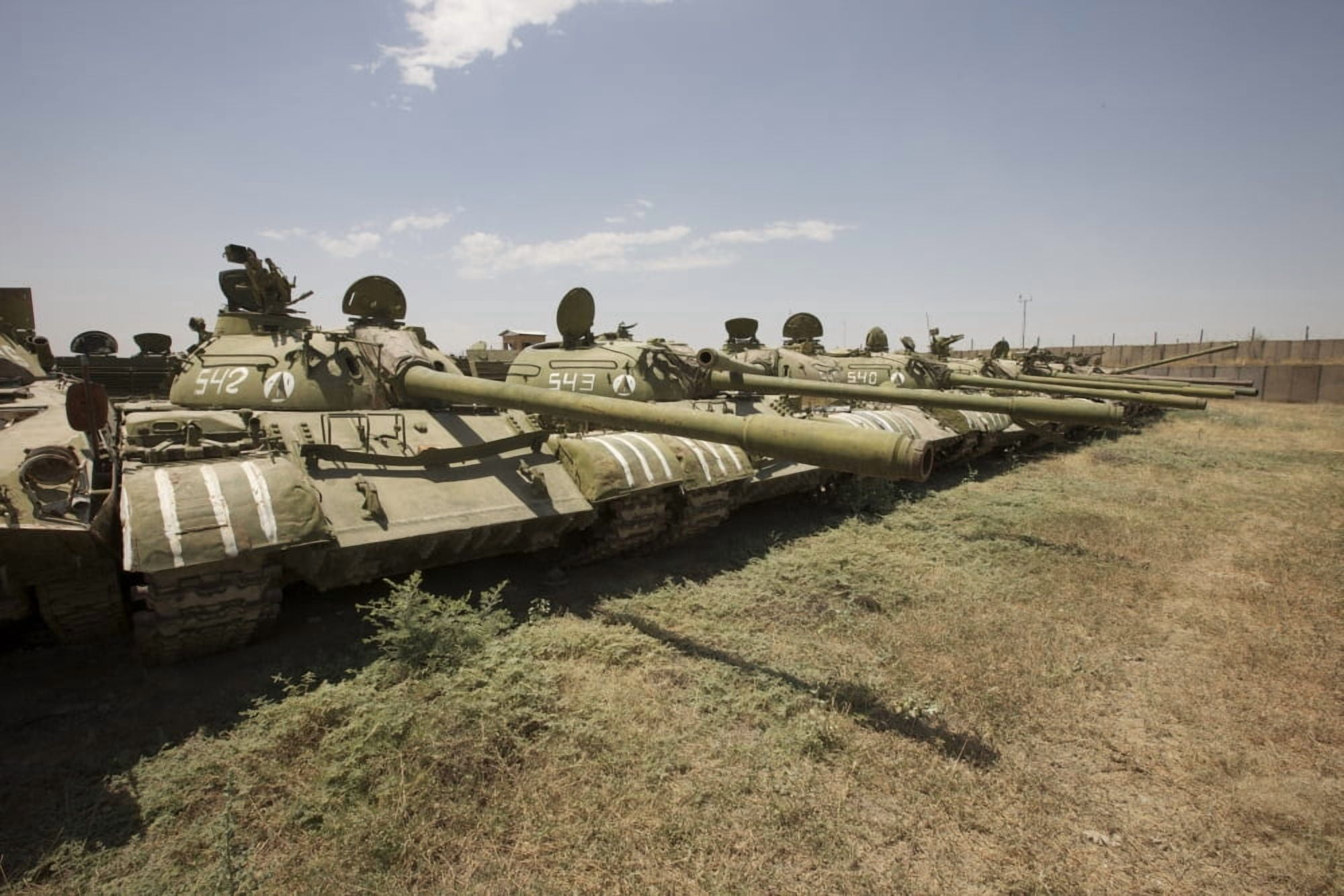 Russian T-54 and T-55 main battle tanks rest in an armor junkyard Canvas Art - Terry MooreStocktrek Images (35 x 24)