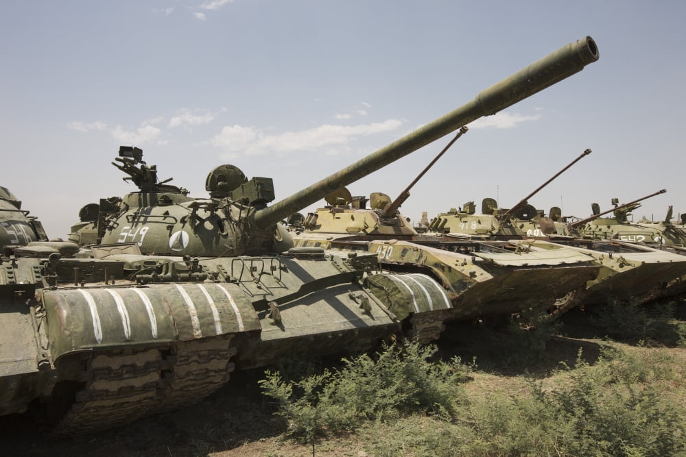 Russian T-54 and T-55 main battle tanks rest in an armor junkyard Canvas Art - Terry MooreStocktrek Images (35 x 24)