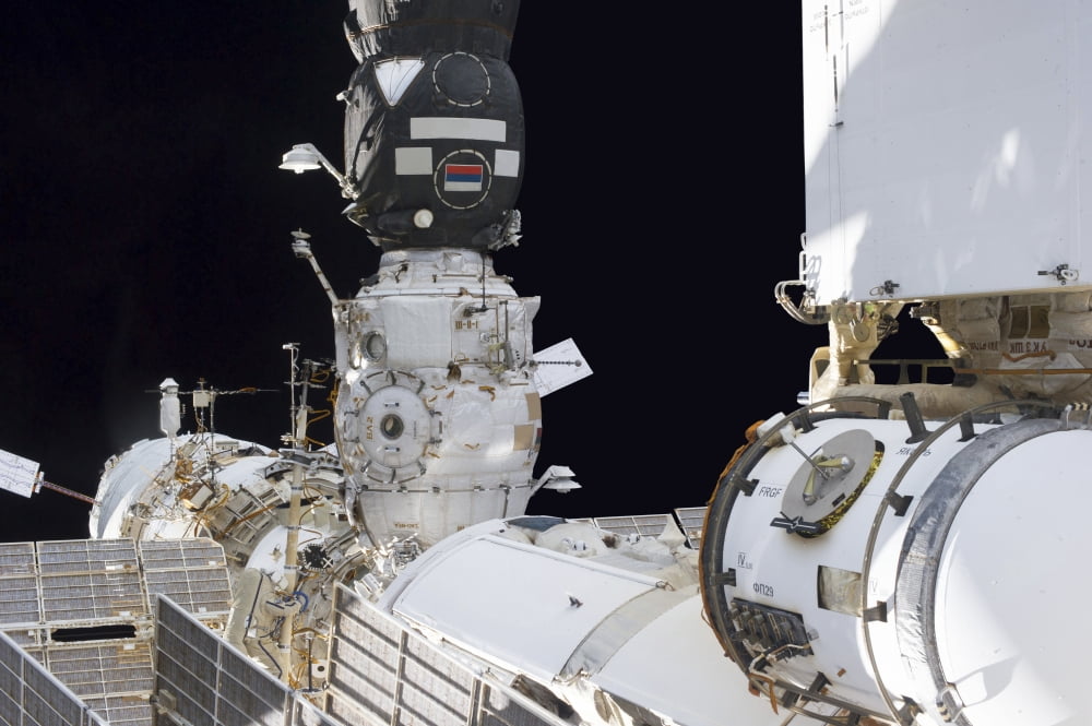 Russian cosmonaut conducts a spacewalk on the International Space Station Canvas Art - Stocktrek Images (35 x 23)