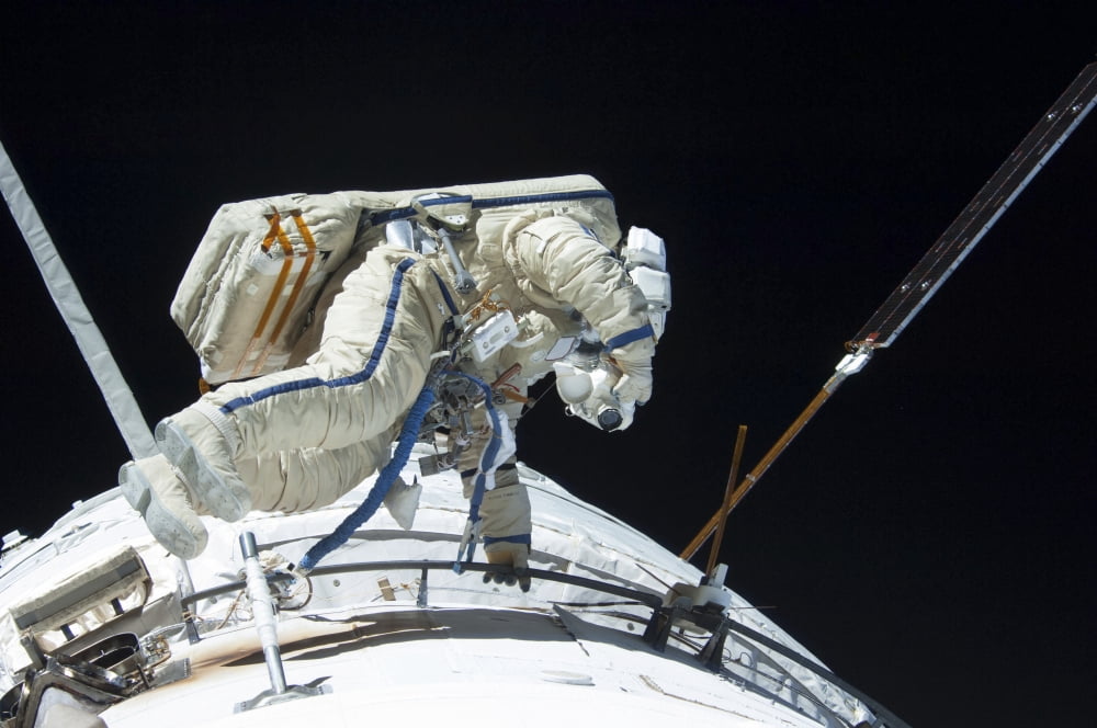 Russian cosmonaut participates in a session of extravehicular activity Canvas Art - Stocktrek Images (34 x 23)