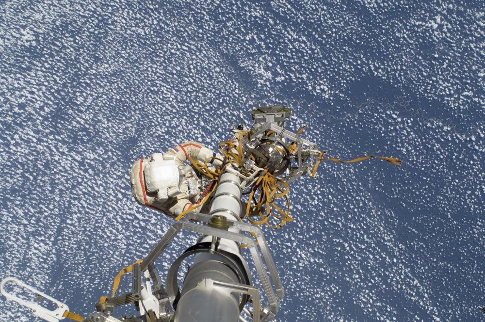 Russian cosmonaut participates in a session of extravehicular activity Canvas Art - Stocktrek Images (35 x 23)