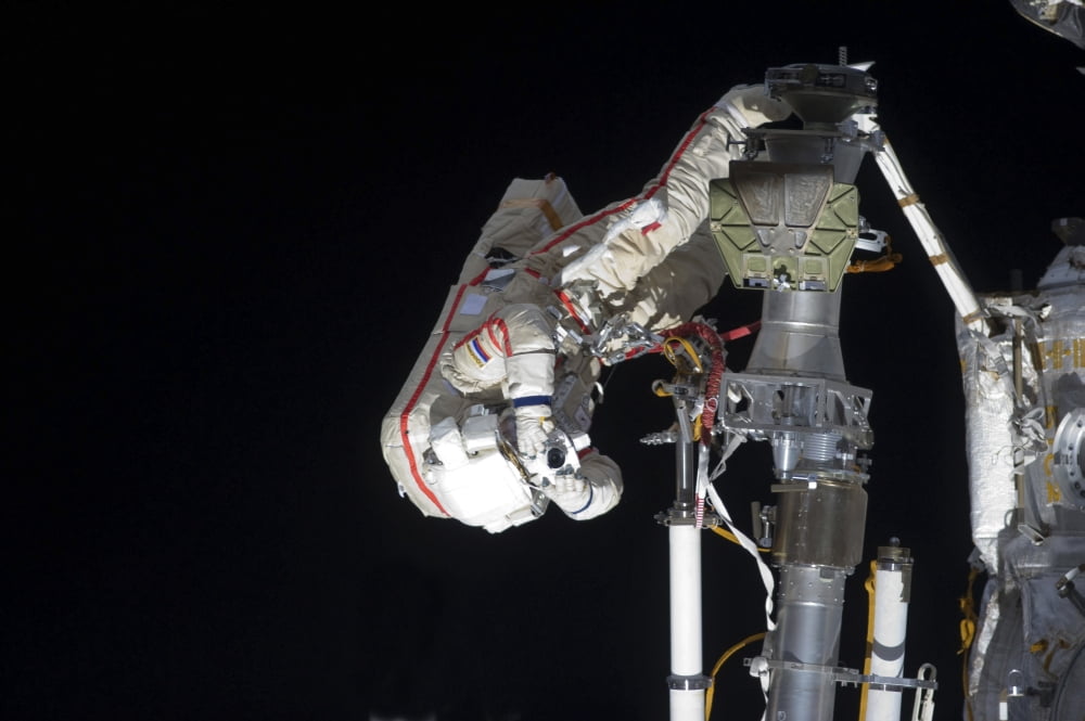 Russian cosmonaut uses a still camera during a spacewalk Canvas Art - Stocktrek Images (35 x 23)