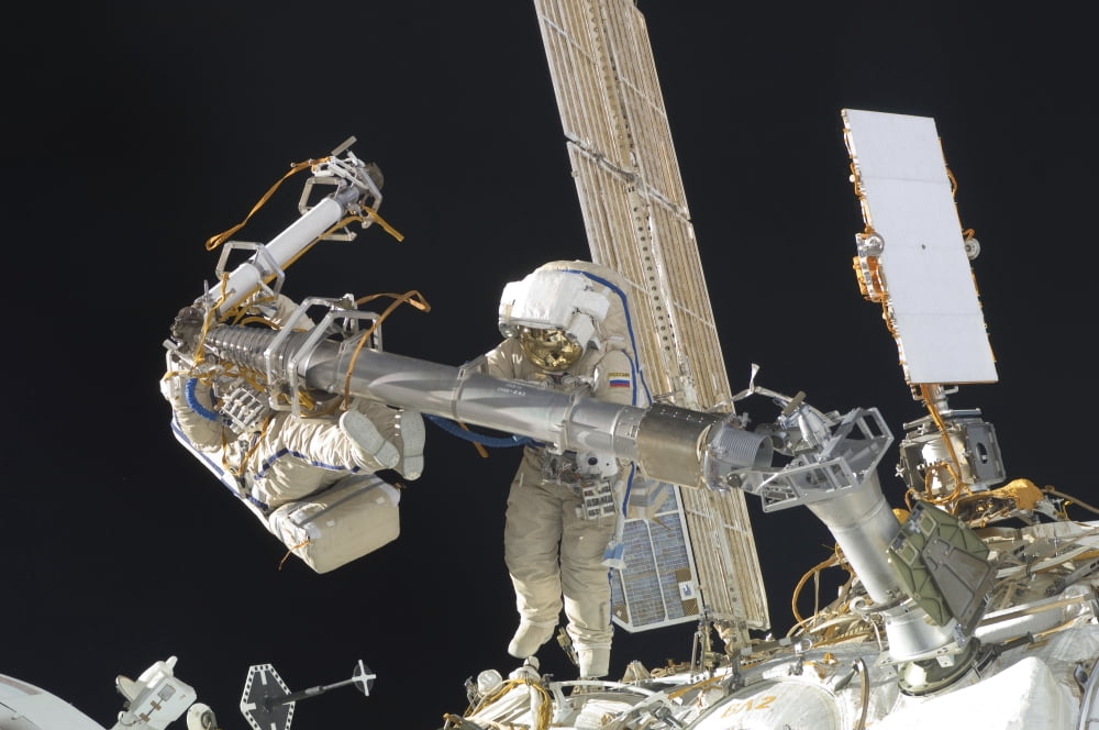 Russian cosmonauts working on the International Space Station Canvas Art - Stocktrek Images (34 x 23)