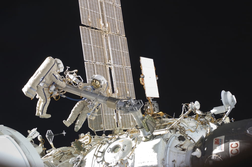 Russian cosmonauts working on the International Space Station Canvas Art - Stocktrek Images (35 x 23)