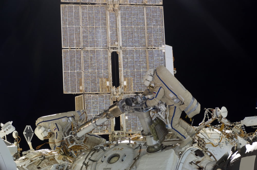 Russian cosmonauts working on the International Space Station Canvas Art - Stocktrek Images (35 x 23)