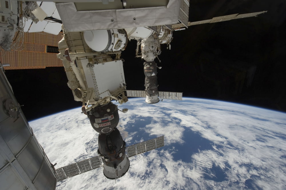 Russian spacecraft docked to the International Space Station Canvas Art - Stocktrek Images (34 x 23)