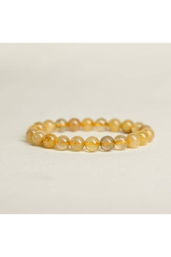 Rutilated Quartz Bracelet Golden Hue Crystal: Natural Gold Rutilated Quartz Type: Beaded Stretch Bracelet Bead Size: 8 MM Bracelet Size: 7 Inches Wrist Size Range: 6 to 7 Bead Shape: Round |