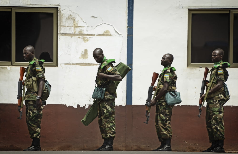 Rwandan soldiers wait in line to board a C-17 Globemaster III Canvas Art - Stocktrek Images (35 x 23)