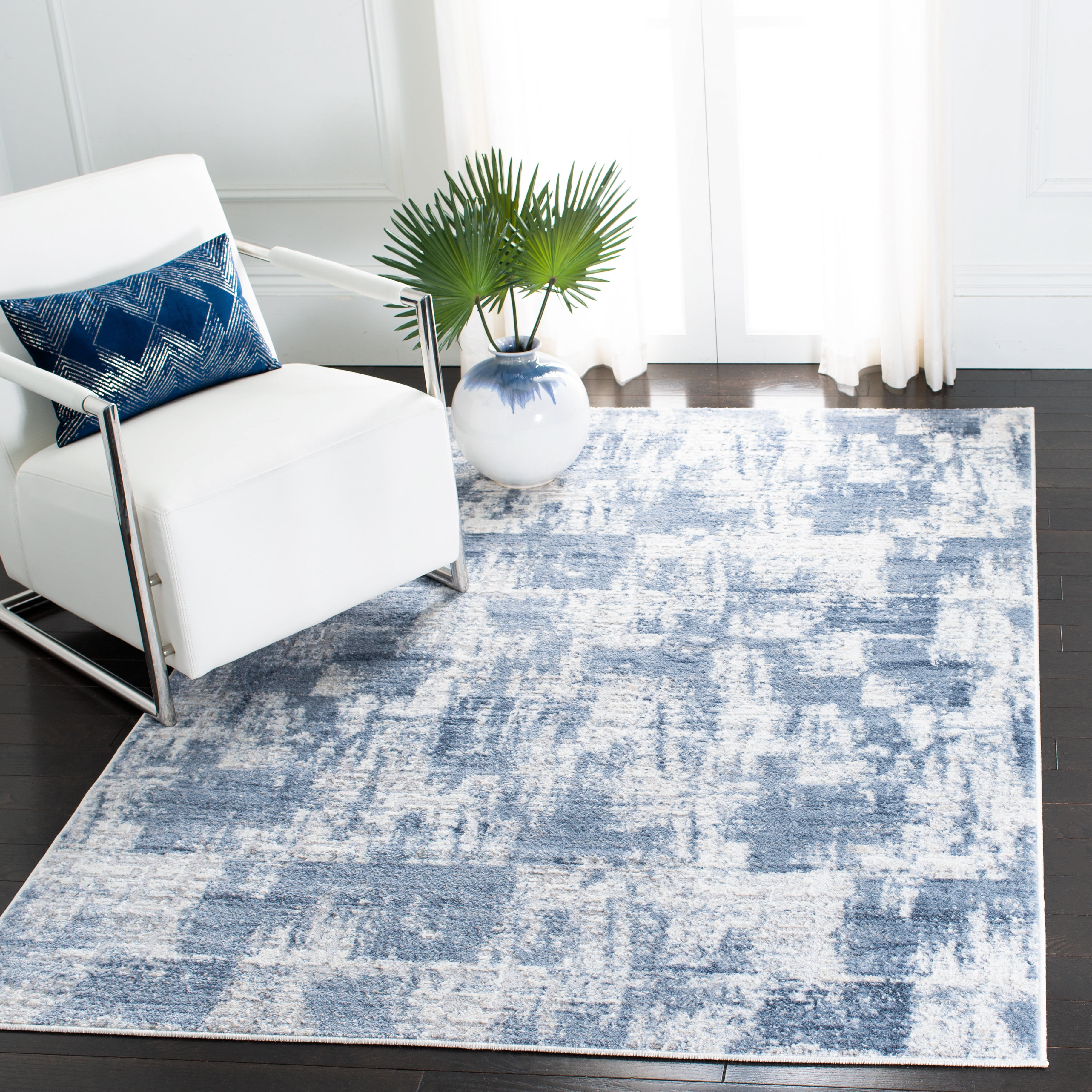 Ivory and Blue Abstract Synthetic Round Area Rug, 54"
