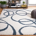 thumbnail image 1 of SAFAVIEH Calico Orval Abstract Polyester Shag Area Rug, Ivory/Blue, 9' x 12', 1 of 8