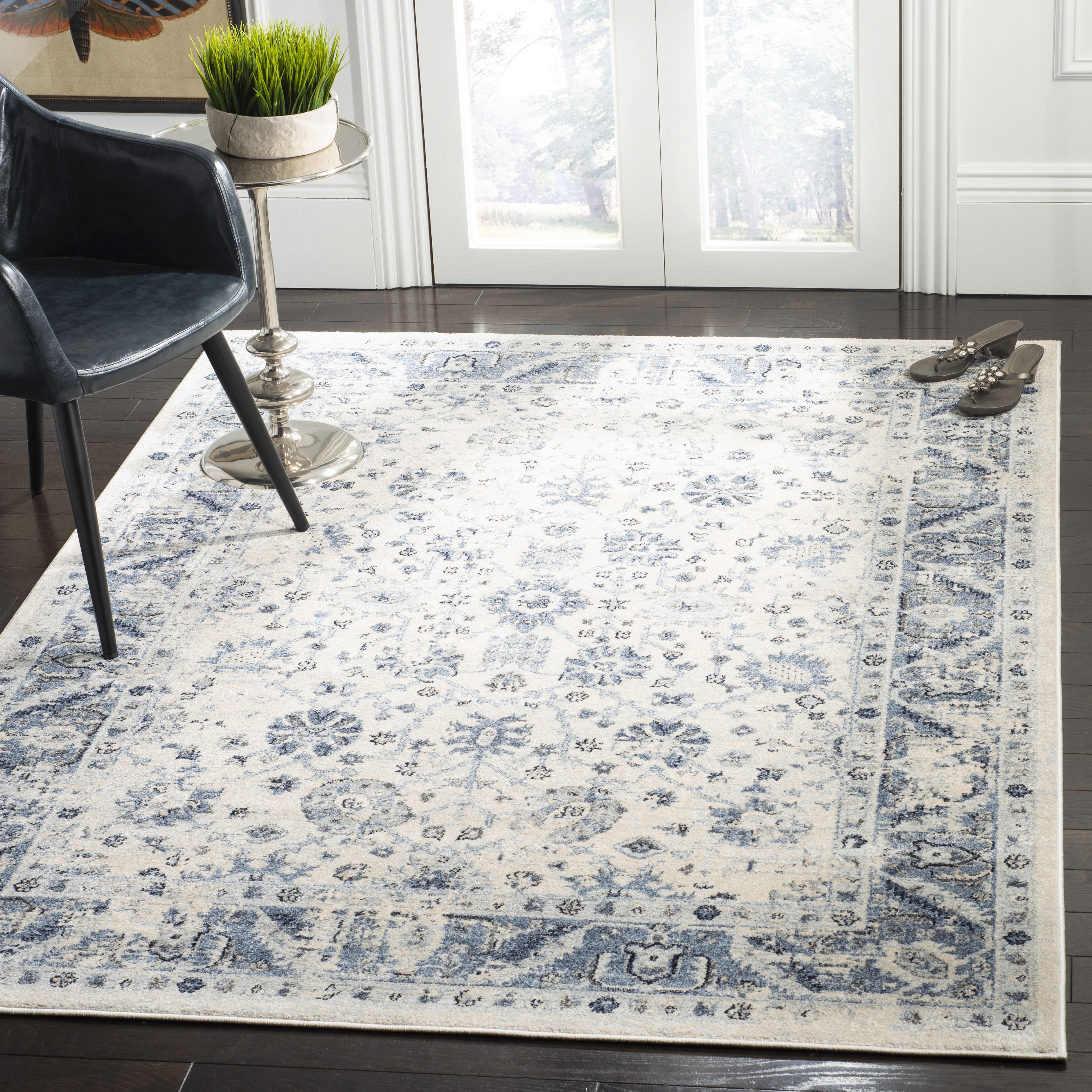 Ivory and Blue 4' x 6' Synthetic Rectangular Area Rug