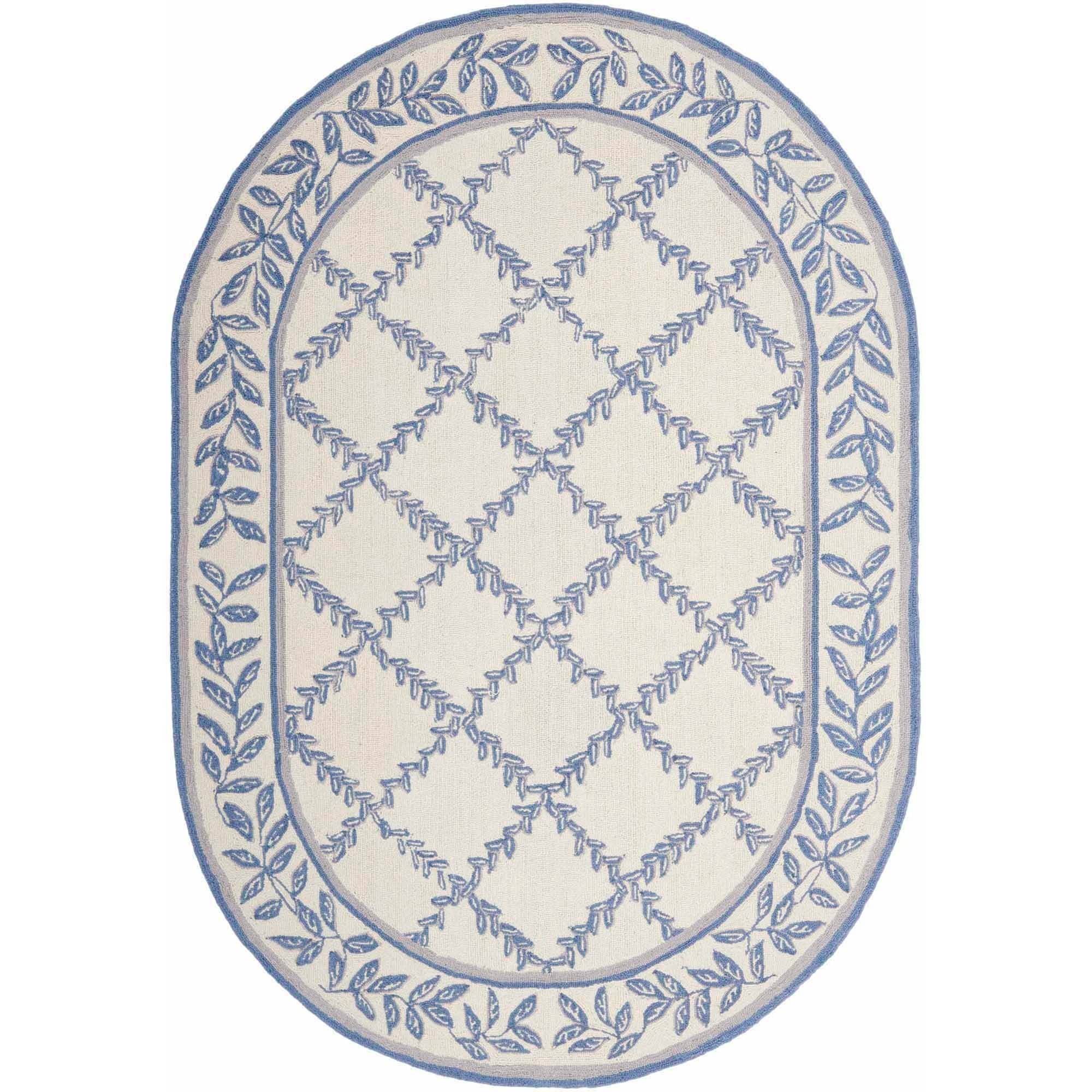 SAFAVIEH Chelsea Alecia Geometric Borders Wool Area Rug, Ivory/Light Blue, 4'6"x6'6" Oval - image 1 of 3