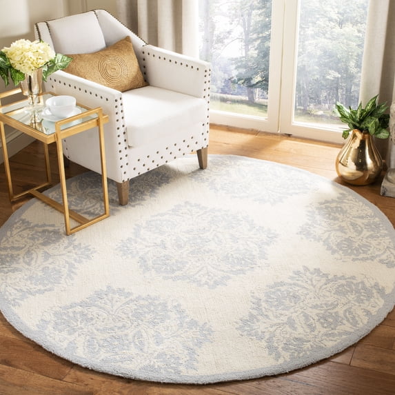 Safavieh Chelsea Vianne Geometric Area Rug, Ivory/Blue, 7'6" x 9'6" Oval