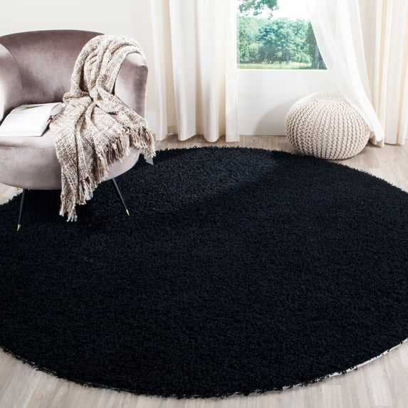 SAFAVIEH Clyde Solid Plush Polyester Shag Area Rug, Black, 7' x 7' Round