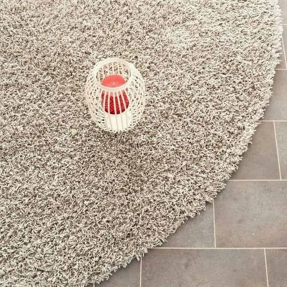 SAFAVIEH Clyde Solid Plush Polyester Shag Area Rug, Silver, 7' x 7' Round