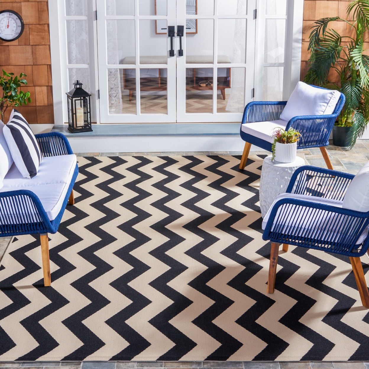 Rectangular 5' x 7' Black and Beige Synthetic Area Rug