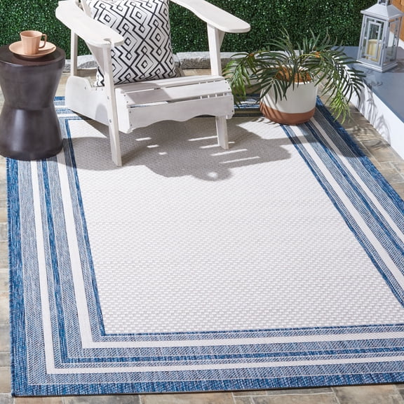 Safavieh Courtyard Ercan Bordered Indoor/Outdoor Area Rug, Ivory/Navy, 8' x 10'