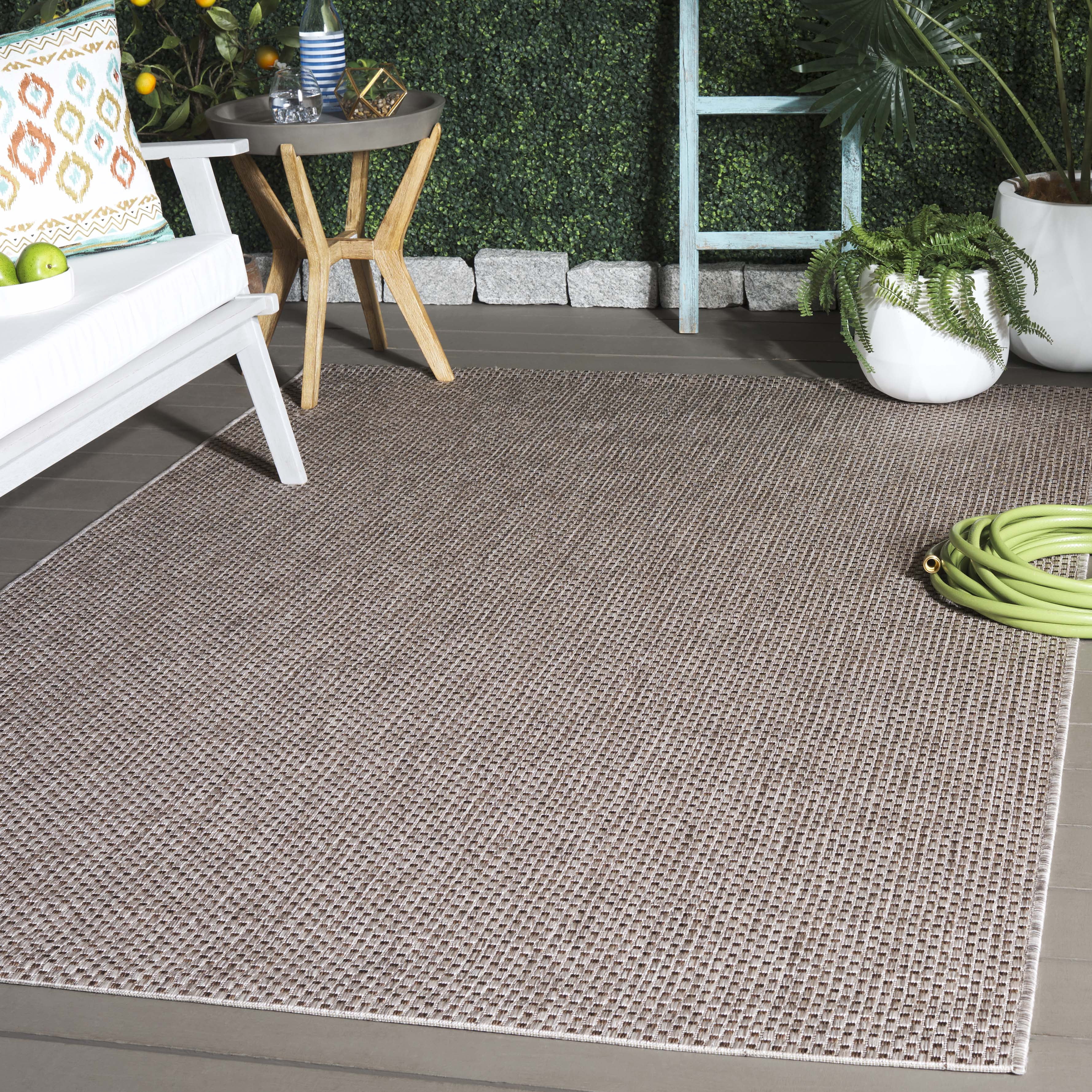 Safavieh Courtyard Finnian Solid Indoor/Outdoor Area Rug, Beige/Brown, 6'7" x 9'6"