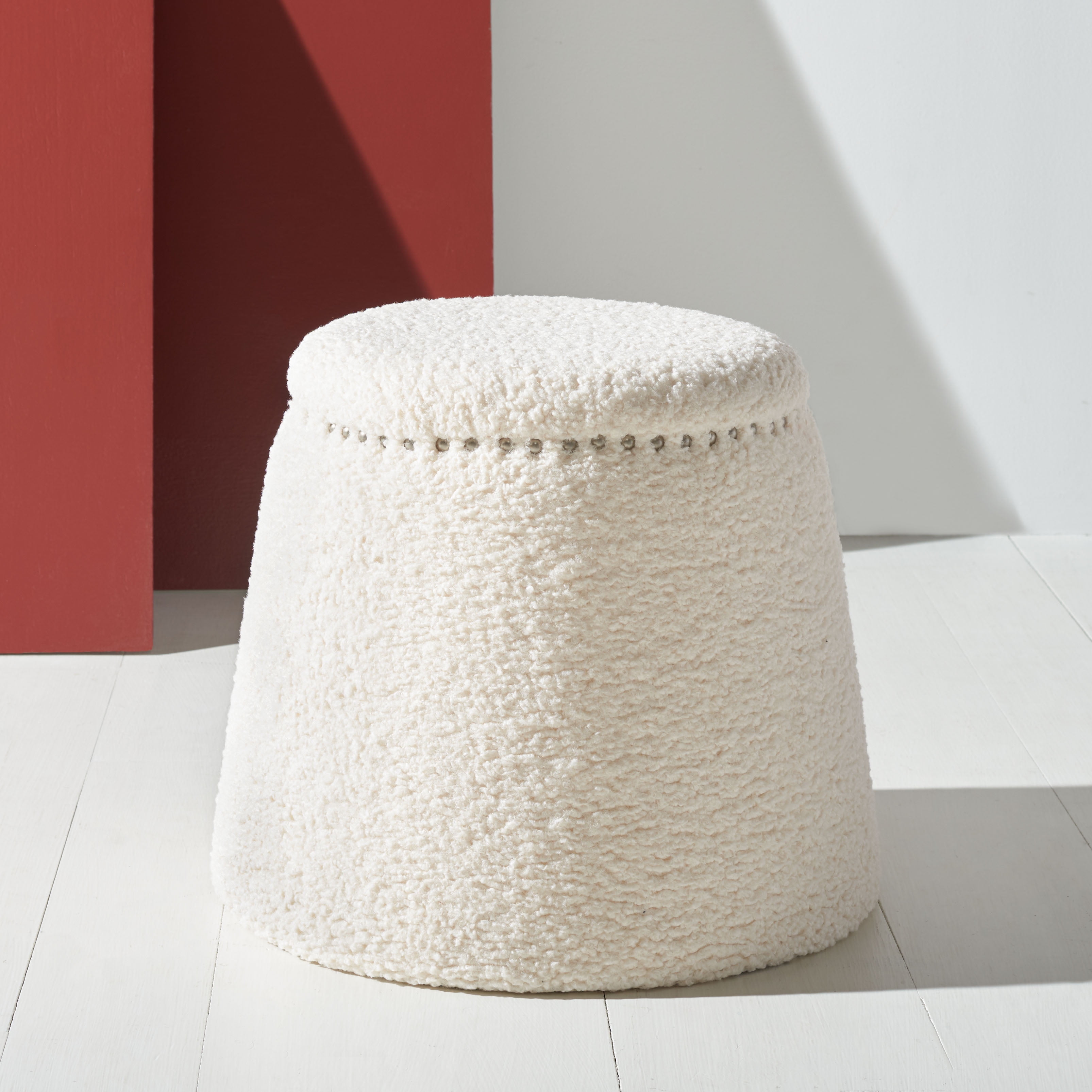 Ellerose Ivory Faux Lamb Wool Round Ottoman with Silver Nailhead Trim