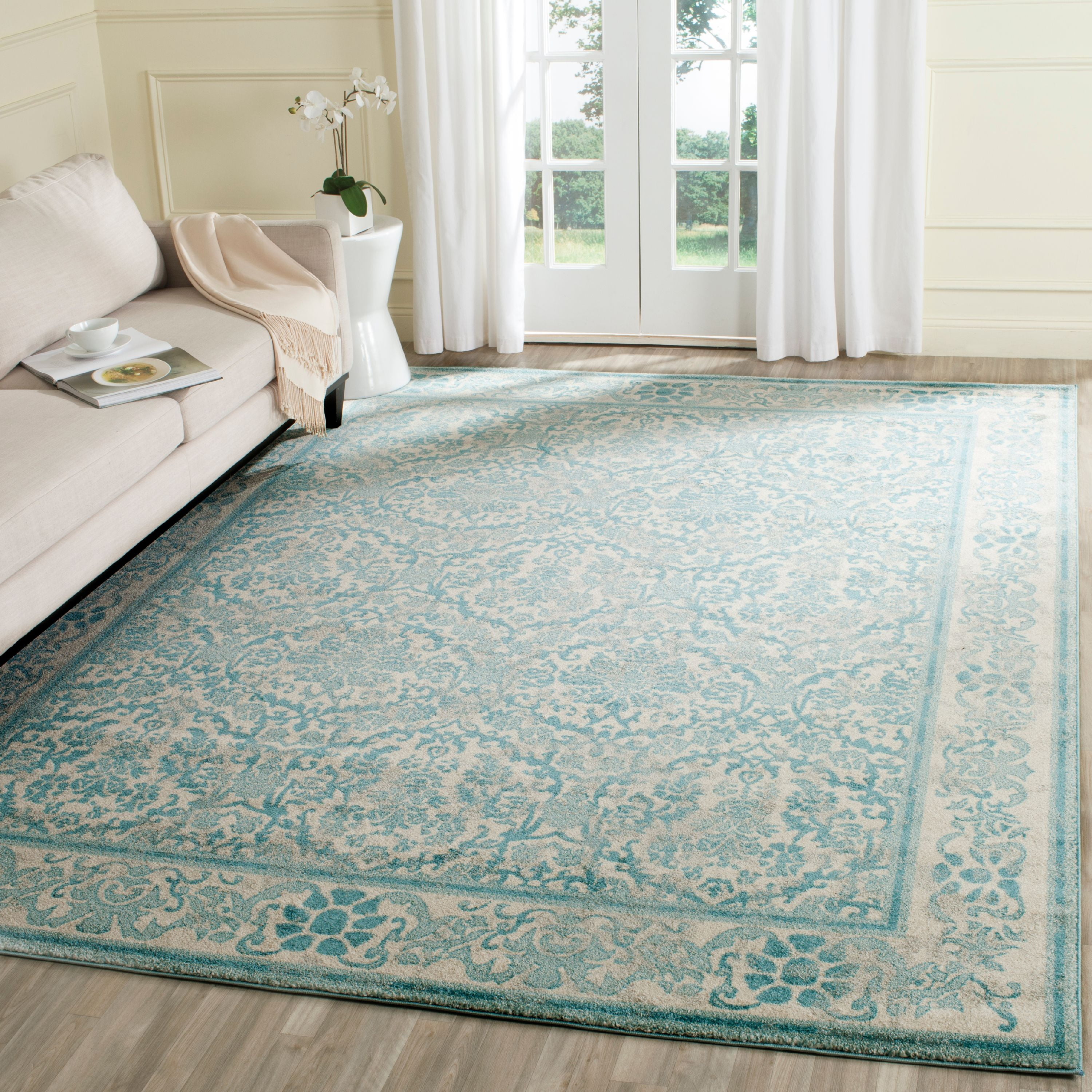 Ivory and Light Blue Floral Synthetic 8' x 10' Area Rug