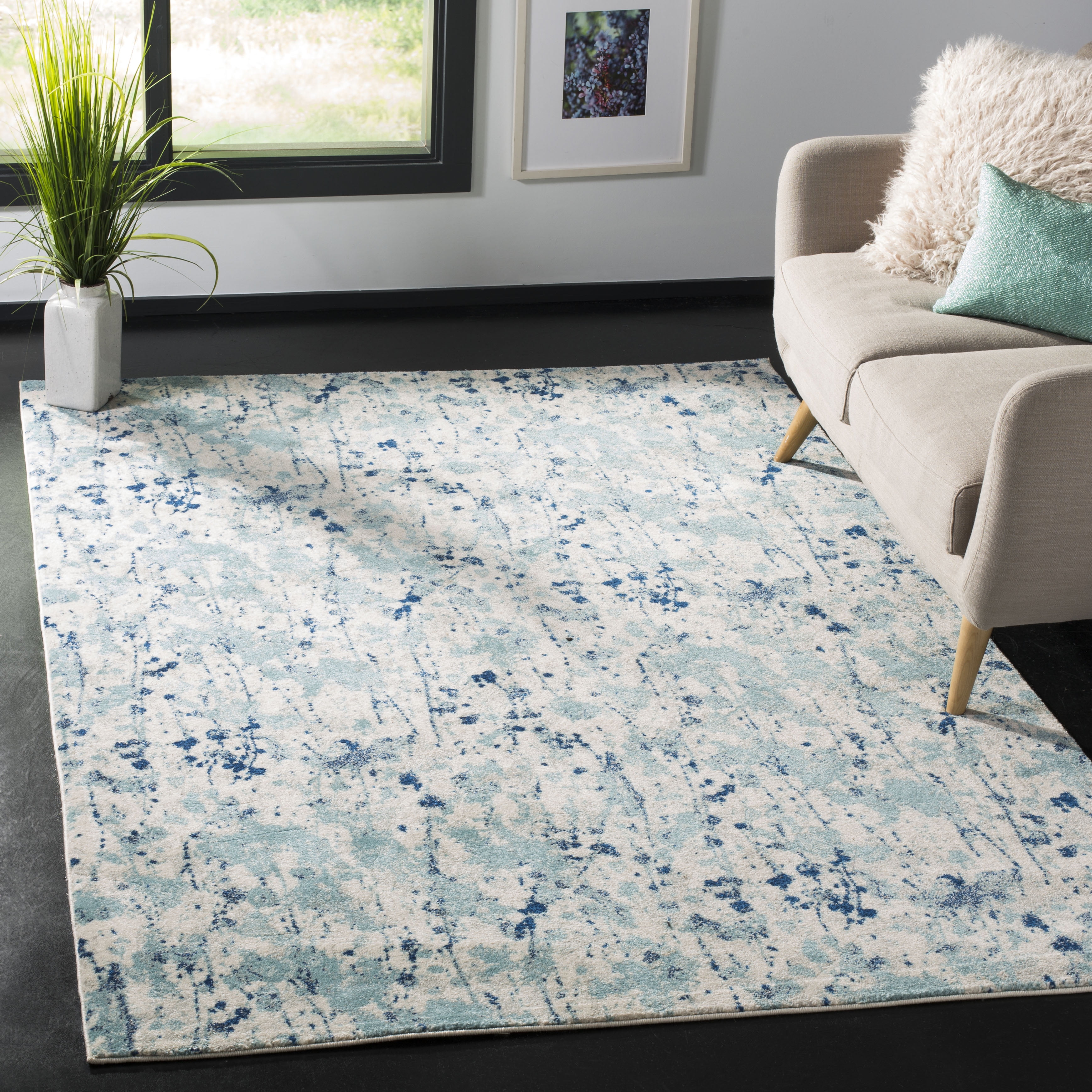 Ivory and Blue Abstract Floral 8' x 10' Area Rug