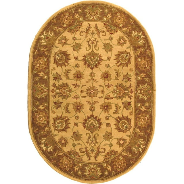 SAFAVIEH Heritage Regis Traditional Wool Area Rug, Ivory/Brown, 4'6" x 6'6" Oval