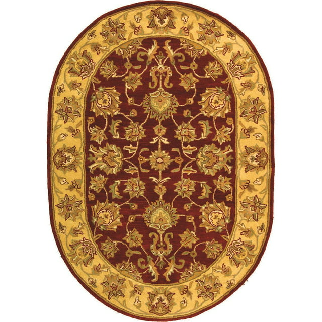 SAFAVIEH Heritage Regis Traditional Wool Area Rug, Red/Gold, 4'6" x 6'6" Oval